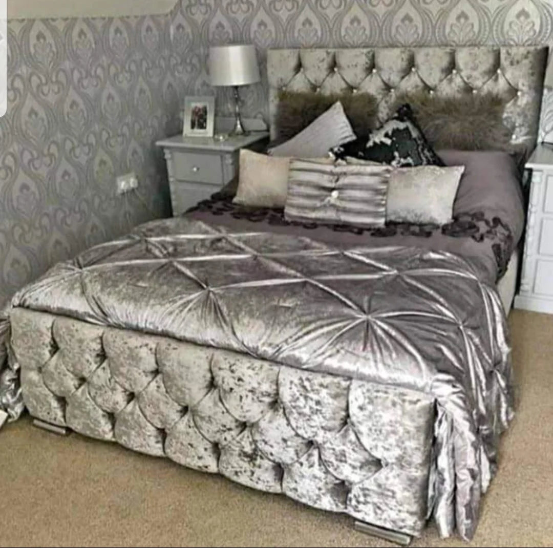 Sleigh Bed in Silver Crushed Velvet with a 47 inch high headboard in Chesterfield style with matching fabric buttons and a chesterfield style with matching fabric buttons footboard named as Rome Bed in Double size