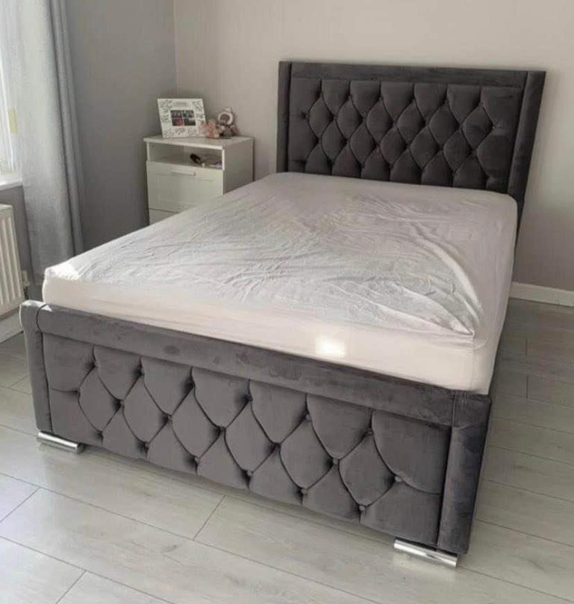 Sleigh Bed in Grey soft Velvet with a 47 inch high headboard in Chesterfield style with matching fabric buttons and a panel around a chesterfield style with matching fabric buttons a panel around footboard named as Vienna Bed in Double size